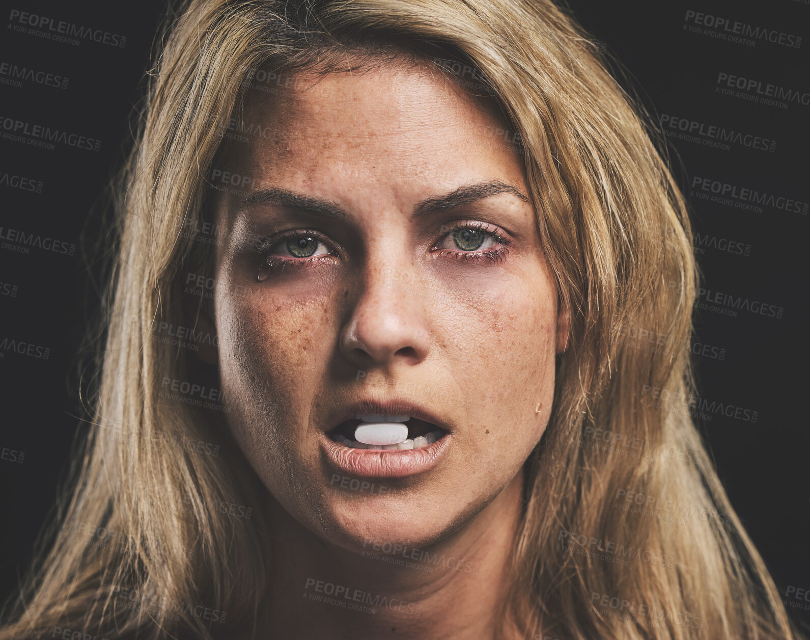 Buy stock photo Woman, face and pill for drug in addiction for substance abuse to cure pain and suffering over black studio background. Portrait of female addict or model addicted to medical pills, help and rehab
