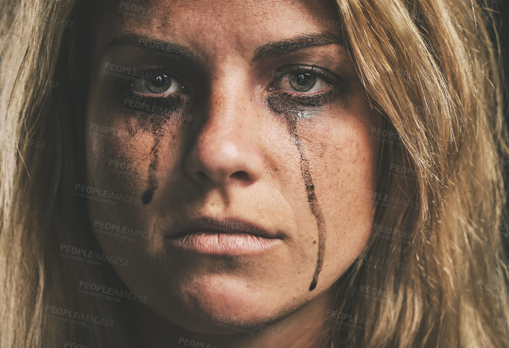 Buy stock photo Face, crying and domestic violence with a woman victim of abuse in studio with makeup closeup. Sad, fear and pain with a scared female feeling angry or emotional with grief, tears and problems