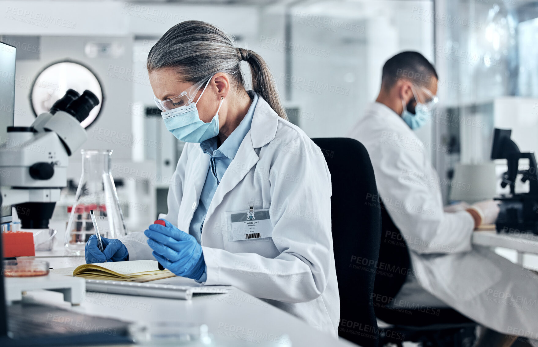 Buy stock photo Science, dna blood and covid research with a woman writing in a notebook for innovation and breakthrough in a lab. Analytics, technology and medicine with a female scientist at work in a laboratory