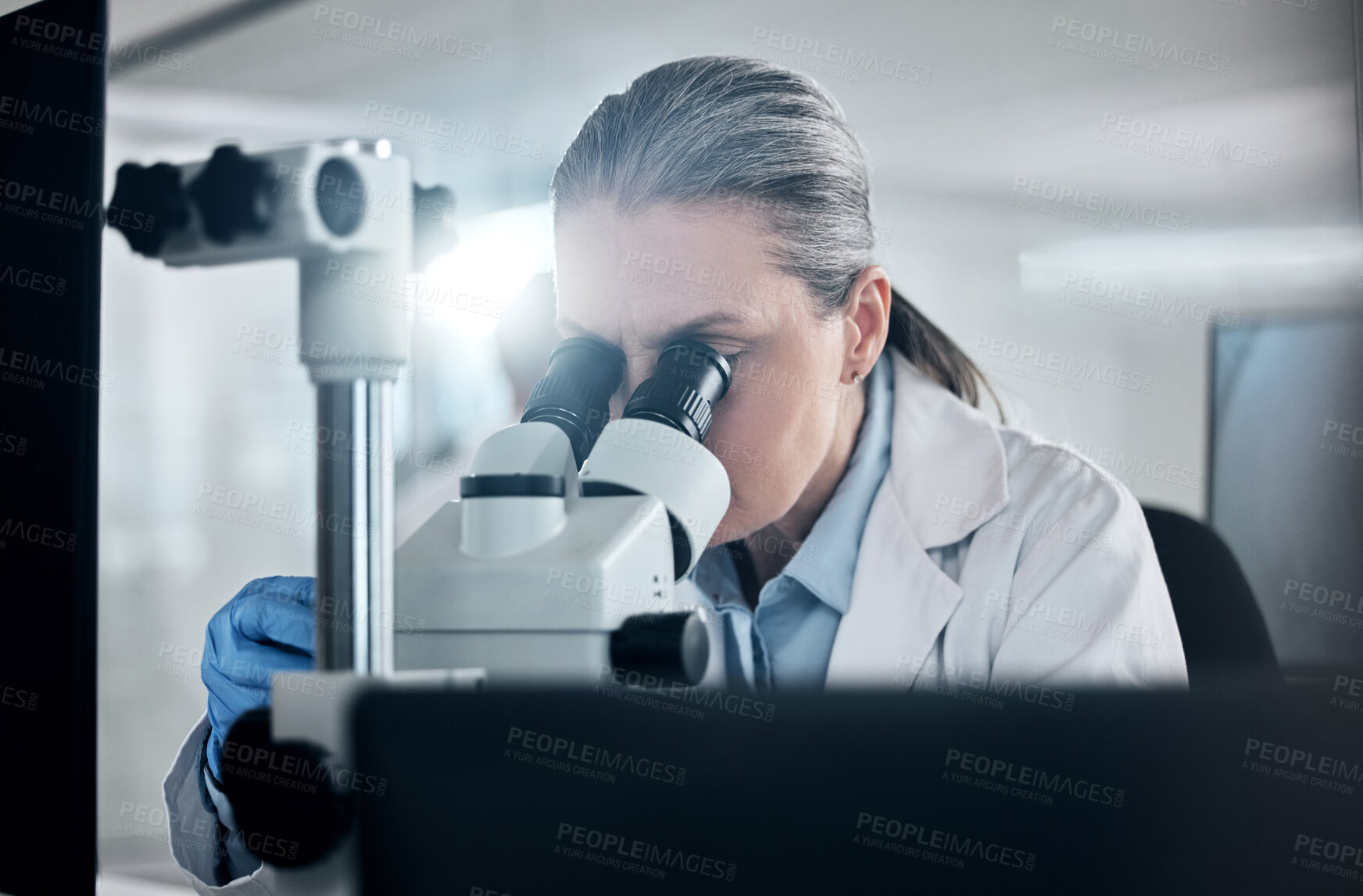 Buy stock photo Scientist innovation with microscope for science research development or test in laboratory. Medical lens, biotechnology expert and analysis or studying sample in light for healthcare investigation