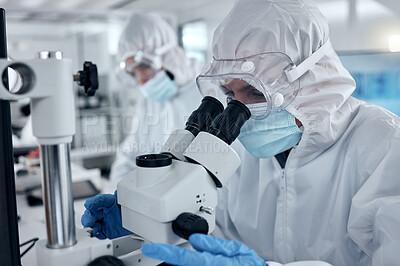 Buy stock photo PPE, covid and DNA scientist with microscope research for science innovation, investigation and development in a test laboratory. Biotechnology people with analysis or studying medical sample in lab