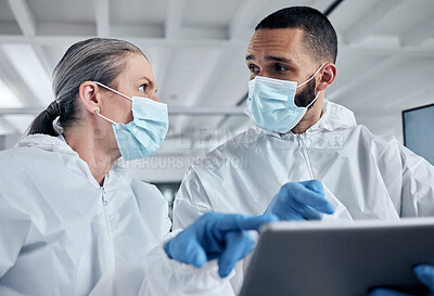 Buy stock photo Scientist team, covid research and tablet with doctors discussing medical information, analysis and teamwork in  lab. Medical man and woman using technology and PPE for safety, health and wellness