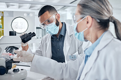 Buy stock photo Science, teamwork and research with a lab partner using microscope. Man and woman scientist doing lab test, biotechnology and medical analytics in laboratory. Working with medicine in healthcare team