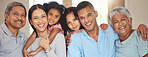 Happy big family, portrait smile and face of men, women with children in happiness at home. Mother, father and kids with grandparents smiling and relaxing together for fun, break or holiday indoors