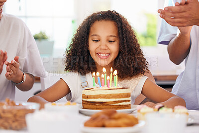 Buy stock photo Little girl, birthday and candle cake for wish in party celebration for child in happiness at home. Happy kid with smile sitting by candles for event or special day celebrating with her parents