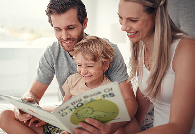Buy stock photo Parents, child and reading dinosaur books in family home for educational fun, learning and happy development in Australia. Mom, dad and kid playing, learning and laughing funny animal story together