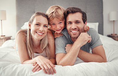 Buy stock photo Mother, father or boy bonding in bedroom at home, house or hotel in trust, love or safety. Family portrait, smile or happy man or woman and child, kid or son on relax security bed in Canada apartment