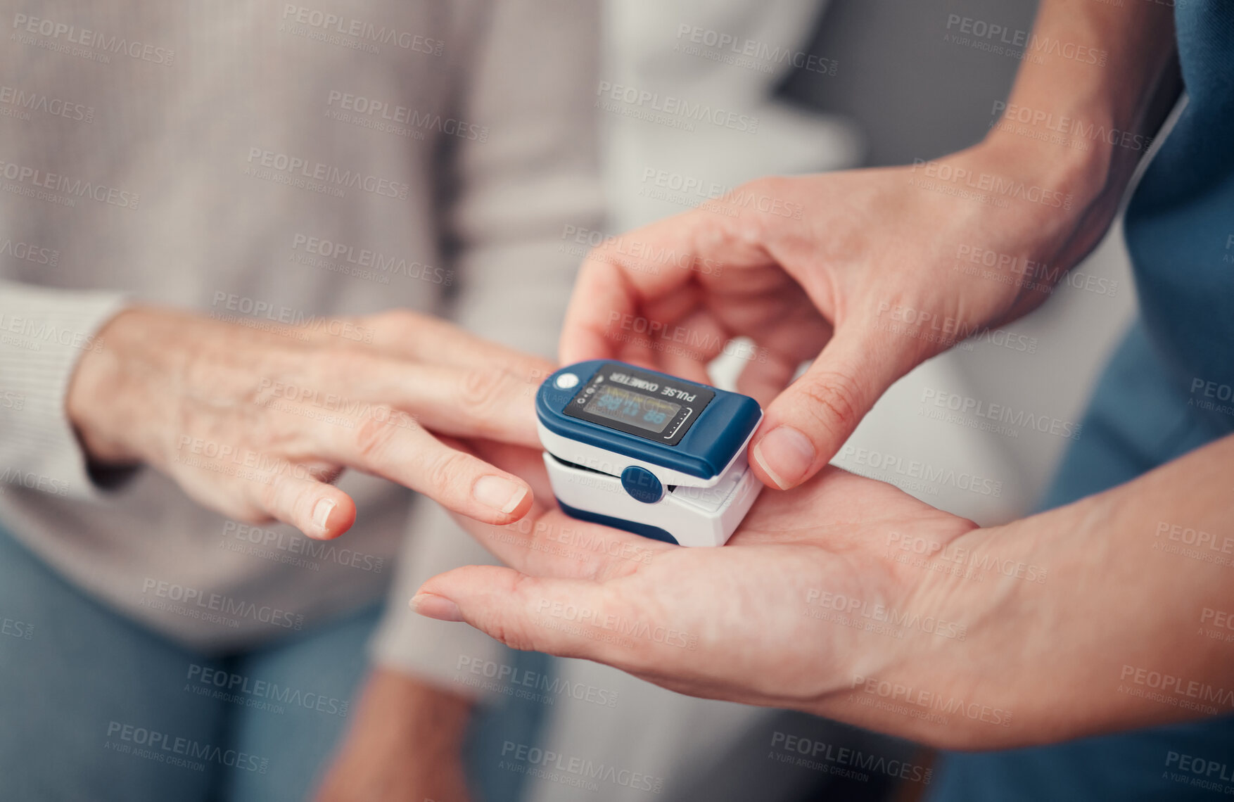 Buy stock photo Hands, patient and finger pulse with nurse to monitor oxygen, rate and health at home. Closeup hand of caregiver helping elderly person in oximetry healthcare to check pulses or monitoring breathing