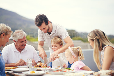 Buy stock photo Thanksgiving lunch, big family and dad turkey carving outdoor with food and happy people. Father, senior grandparents and children with a happiness smile on a balcony table ready to eat with the kids