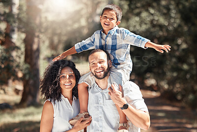 Buy stock photo Happy, smile and portrait of a family in forest together having fun in nature while on holiday. Happiness, love and caring parents from puerto rico with their child in woods while on summer vacation.