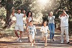 Nature, running and happy family cheering on children in a park having fun on summer holiday vacation in New York. Mother, father and grandparents supporting kids in a playful  race for exercise