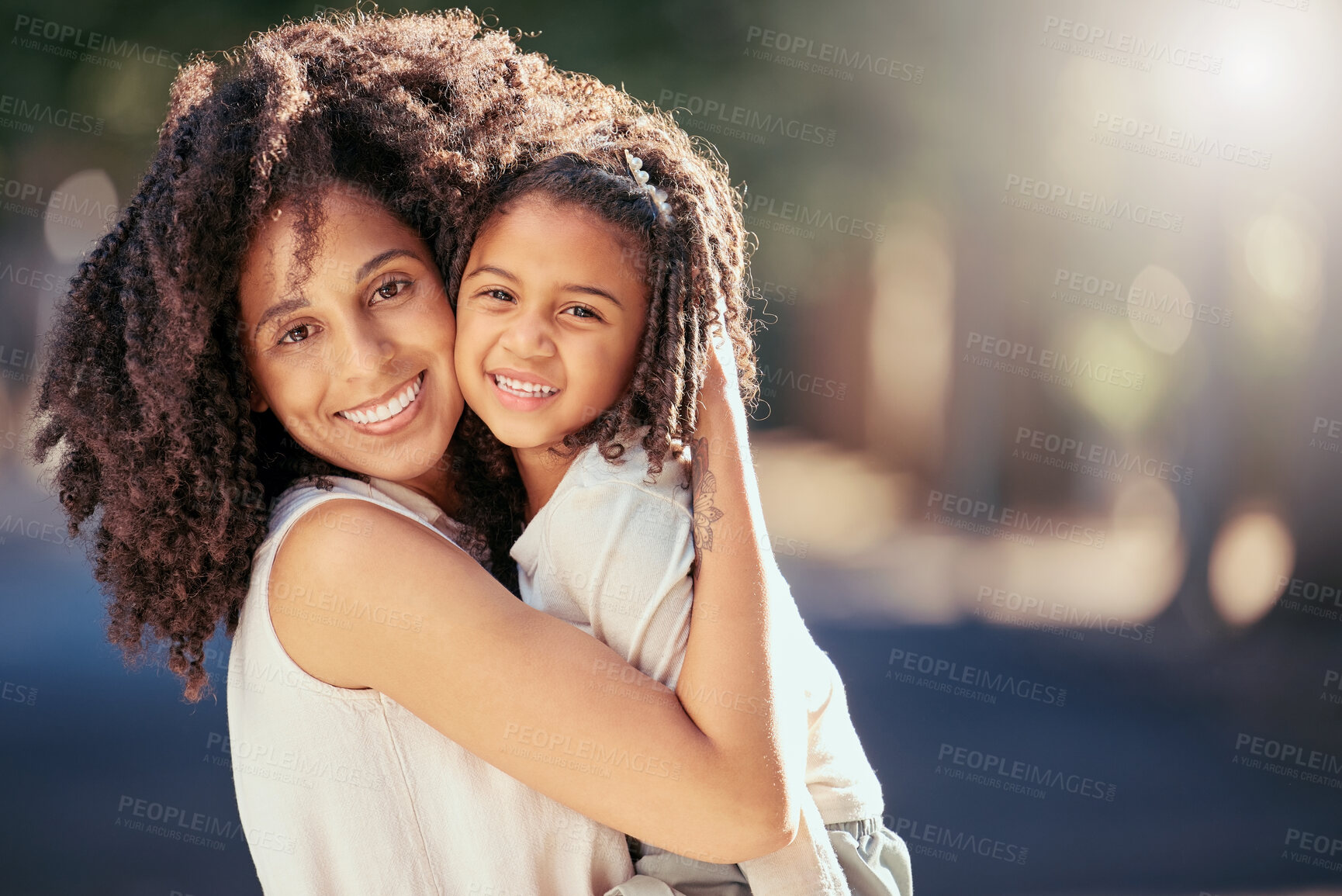 Buy stock photo Black mother with girl child hug in a park with summer lens flare for love, care or growth development outdoor wellness. Happy natural mom bonding with kid in nature portrait together for mothers day