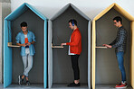 Young business people working in colorful office cubicles in workplace