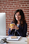 Successful business woman drinking coffee in office smiling confident independent female entrepreneur sitting at desk