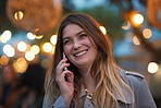 Business woman using smartphone having phone call talking on mobile phone city evening