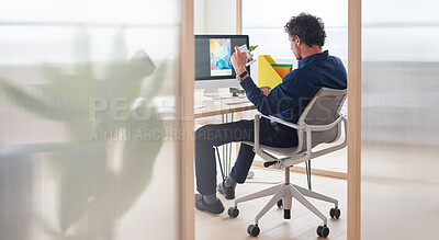 Businessman using computer graphic designer brainstorming creative ideas for magazine on screen sitting in office