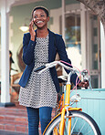 African american woman with bicycle using smartphone talking on mobile phone in city