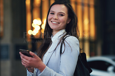 Buy stock photo Portrait independent business woman smiling using smartphone in city texting on mobile phone in urban evening