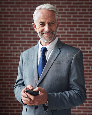 Buy stock photo Portrait mature businessman smiling confident corporate boss in office using smartphone