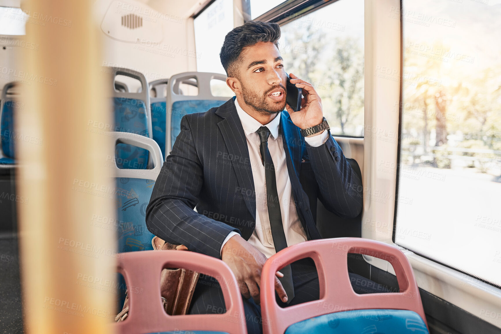 Buy stock photo Businessman consulting on a phone call on a bus in the morning travel to work in the city. Entrepreneur, employee and worker speaking to a contact on a mobile cellphone in public transportation