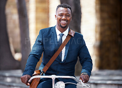 Buy stock photo Portrait of a happy businessman on bike or bicycle on his morning travel into work in the city. Employee,, entrepreneur or worker on the ride with decrease his carbon footprint with a suite and smile