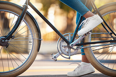 Buy stock photo Bike, shoes and cycling with a woman cyclist riding her bicycle outside on the road or street during the day. Sport, exercise and fitness with a female rider on transport with wheels and pedals