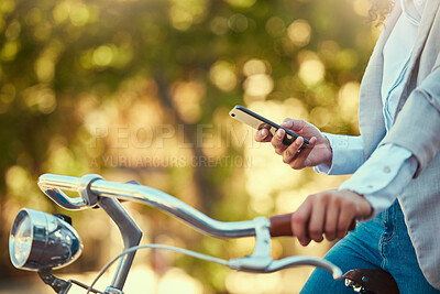 Buy stock photo Hands of a girl, on bicycle and using smartphone app, social media and doing a internet or web search closeup. Woman uses her bike for health, fun or travel by cycling to park, work and home or city