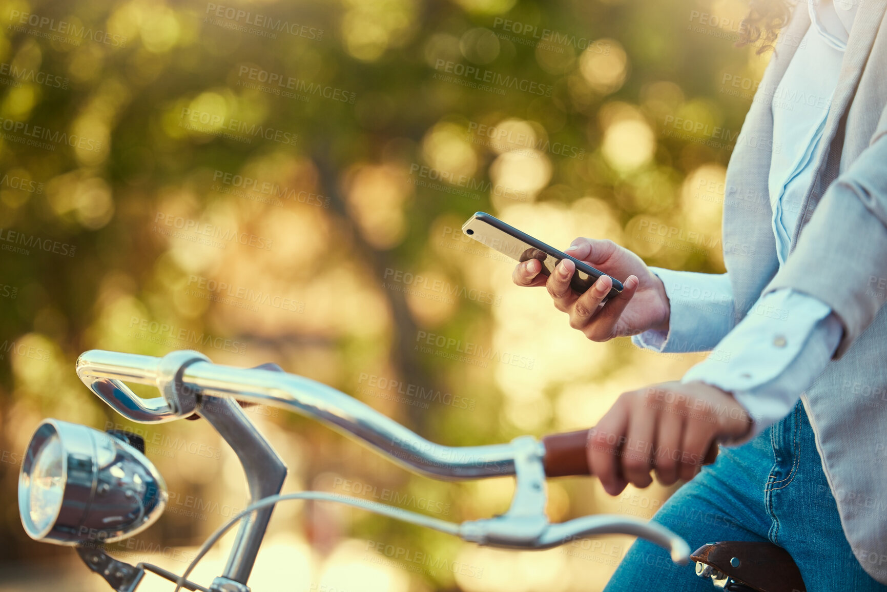 Buy stock photo Hands of a girl, on bicycle and using smartphone app, social media and doing a internet or web search closeup. Woman uses her bike for health, fun or travel by cycling to park, work and home or city