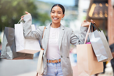 Buy stock photo Woman shopping, fashion and retail gift bags for customer buying stylish clothes and spending money on a city spree. Portrait smile, happy and fun lady with cool, trendy and sales presents from store