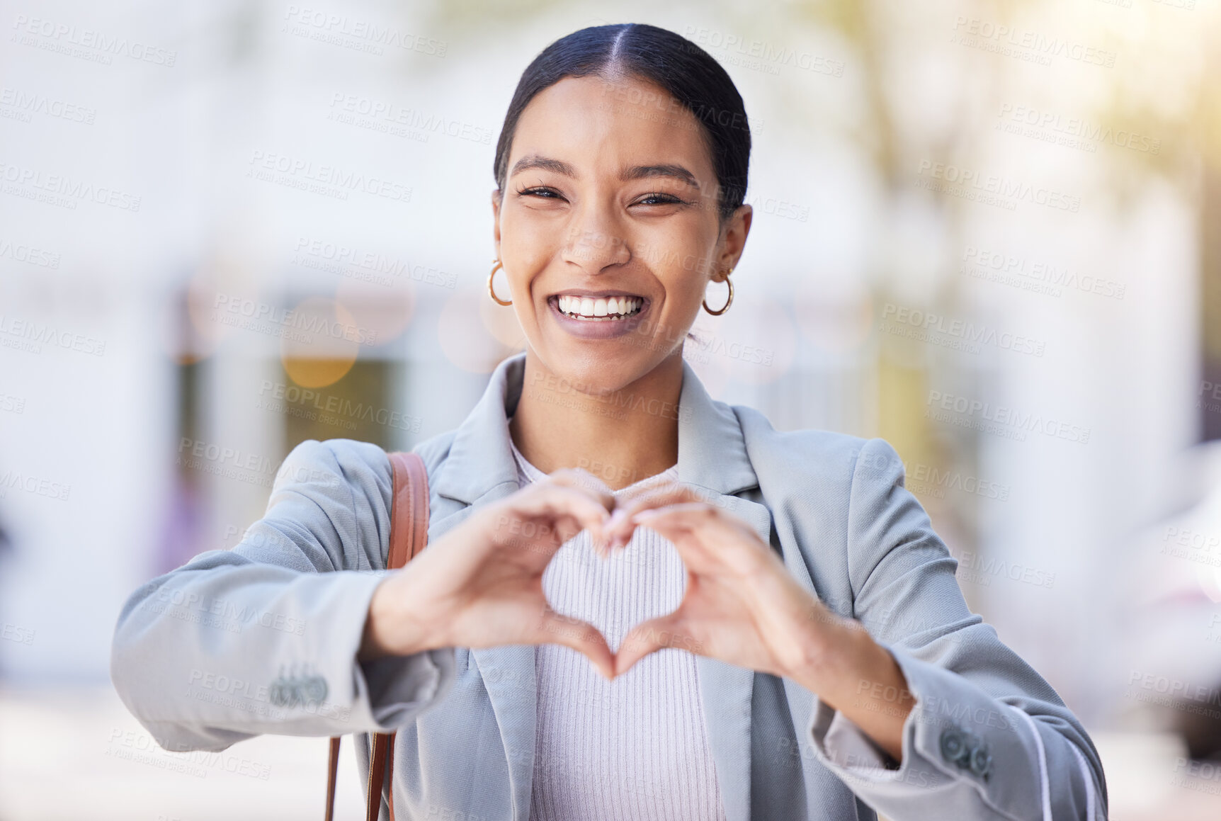 Buy stock photo Love, heart and happy hand sign of a young female with a smile with a positive mindset and vision. Portrait of a modern business woman smiling with a hands gesture showing support, trust and care