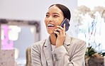 Happy woman smile while on a phone call with a contact while laughing and talking indoor at the store. Business woman networking while in a shopping mall with a mobile 5g smartphone for communication