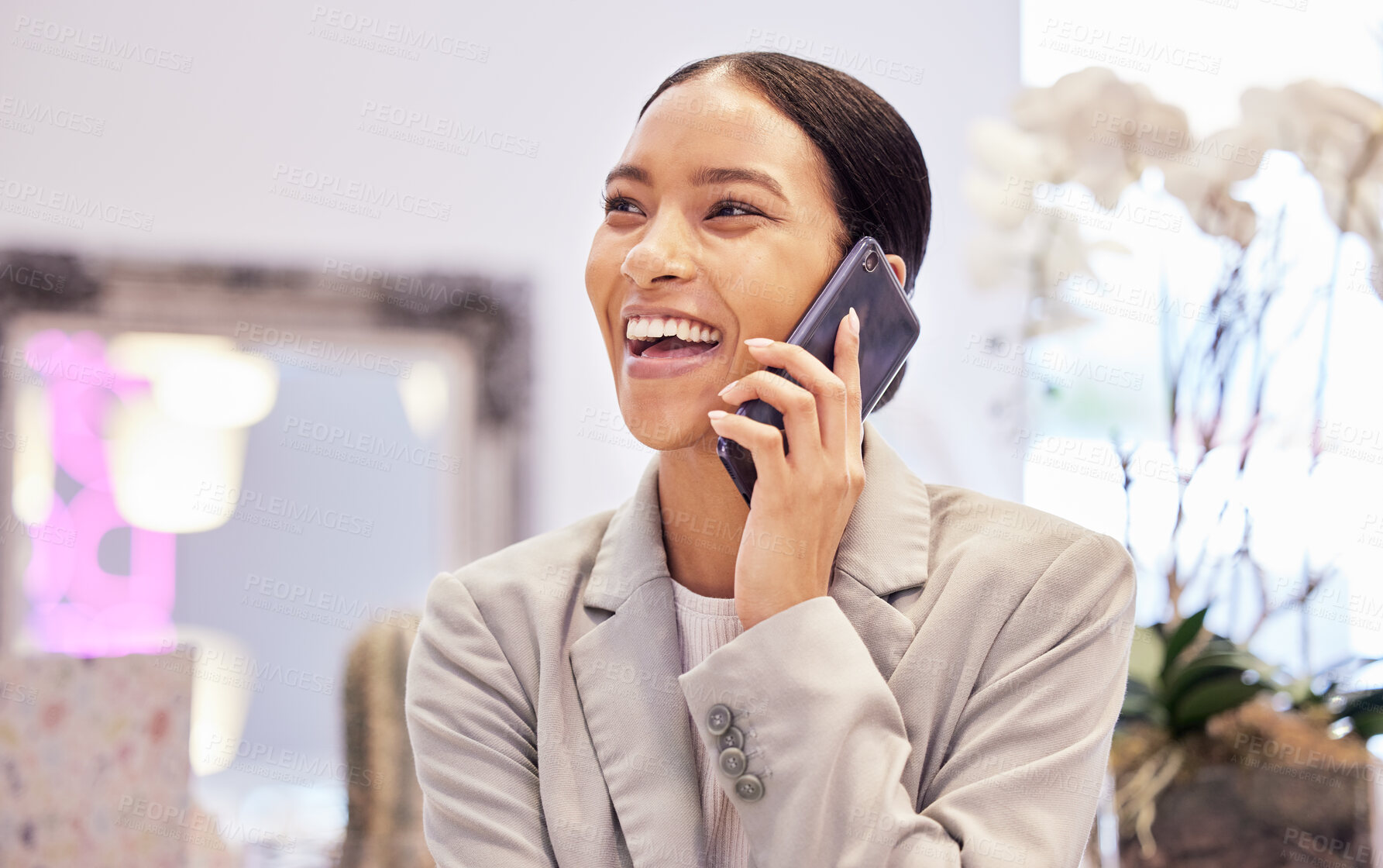 Buy stock photo Happy woman smile while on a phone call with a contact while laughing and talking indoor at the store. Business woman networking while in a shopping mall with a mobile 5g smartphone for communication