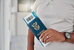 Man at airport with passport, travel visa and ticket for plane flight of international immigration. Hands of tourist, traveller and passenger waiting for airplane departure with identity documents