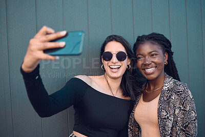 Buy stock photo Happy girl friends taking a selfie on phone while traveling around the city on summer vacation. Diversity, love and smiling women taking picture on smartphone to post on social media and the internet