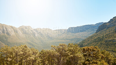 Buy stock photo Landscape, mountain view and blue sky with copy space in remote countryside, eco nature and reserve for hiking, exploring and walking. Scenery of environmental and sustainable land with green forest