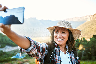 Buy stock photo Hiking, tourist and woman taking selfies, photo and video call for social media while exploring, travel and sightseeing in nature outdoors. Happy, active and free female enjoying scenic fresh hike