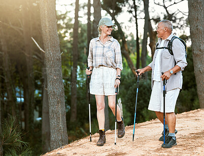 Buy stock photo Hiking, adventure and exploring with a senior couple or friends having fun, exercising and enjoying the outdoors. Walking, discovering and journey with old people talking in nature, forest or woods