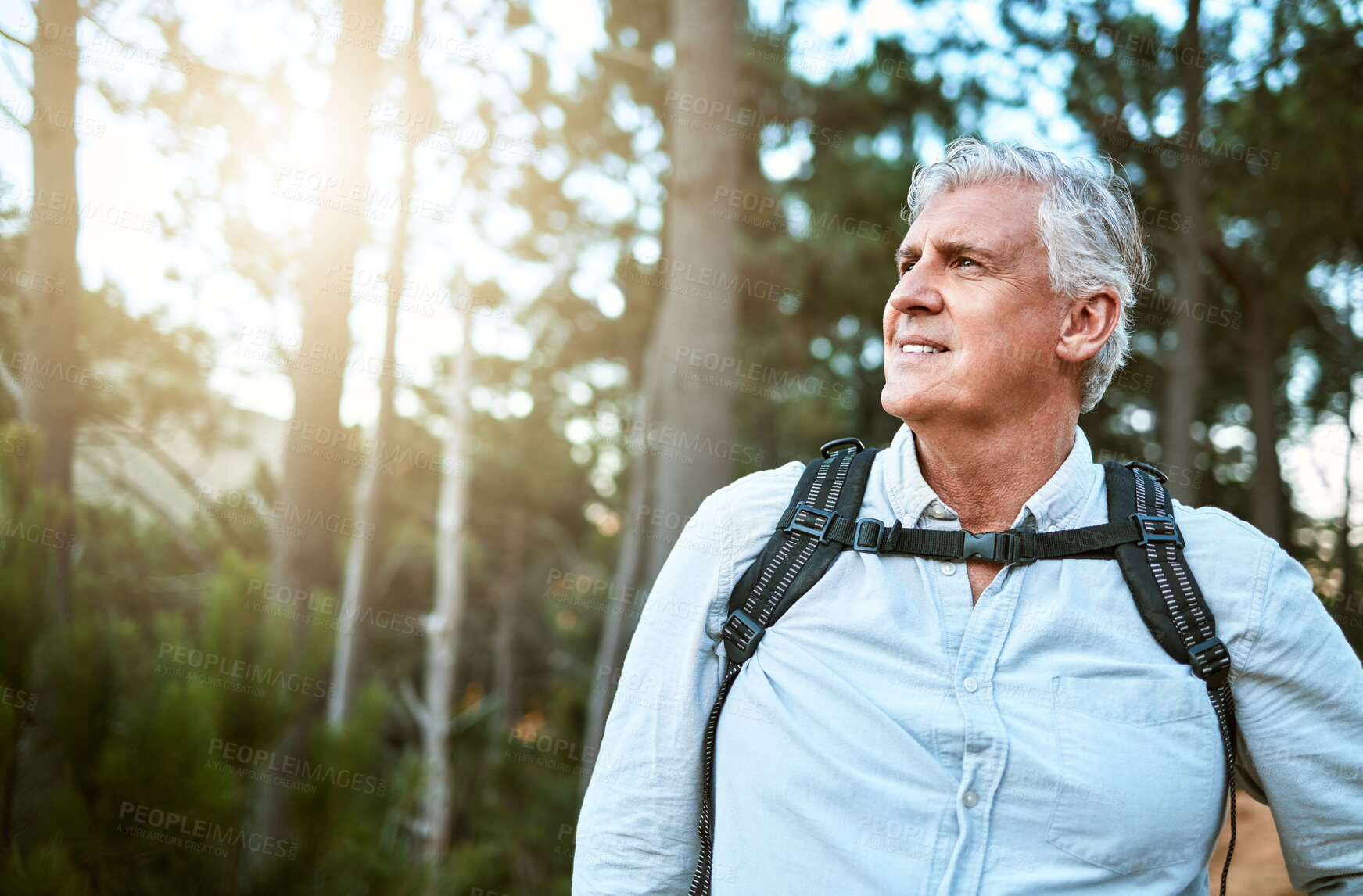 Buy stock photo Senior man walking on hike in nature, looking at view on mountain and hiking on a relaxing getaway vacation alone in the countryside. Retired, mature and happy guy on walk for exercise and fitness