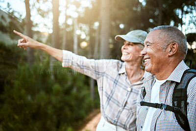 Buy stock photo Hiking, adventure and freedom with a senior couple enjoying and exploring the forest or woods and bonding together. Happy, carefree and exploring retired man and woman looking at the views outdoors
