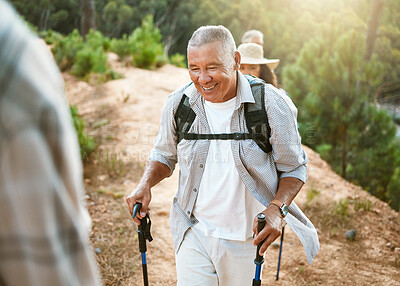 Buy stock photo Hike, trekking sticks and senior male walking with friends for fitness and health in nature. Healthy, active and smiling mature man hiking with a backpack. Old group on an outdoor wellness adventure