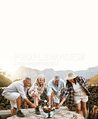 Buy stock photo Melting marshmallows by a fire on a nature getaway vacation, senior group bonding and relaxing together with candy in the mountain. People on fun hiking holiday, adventure or freedom with copy space