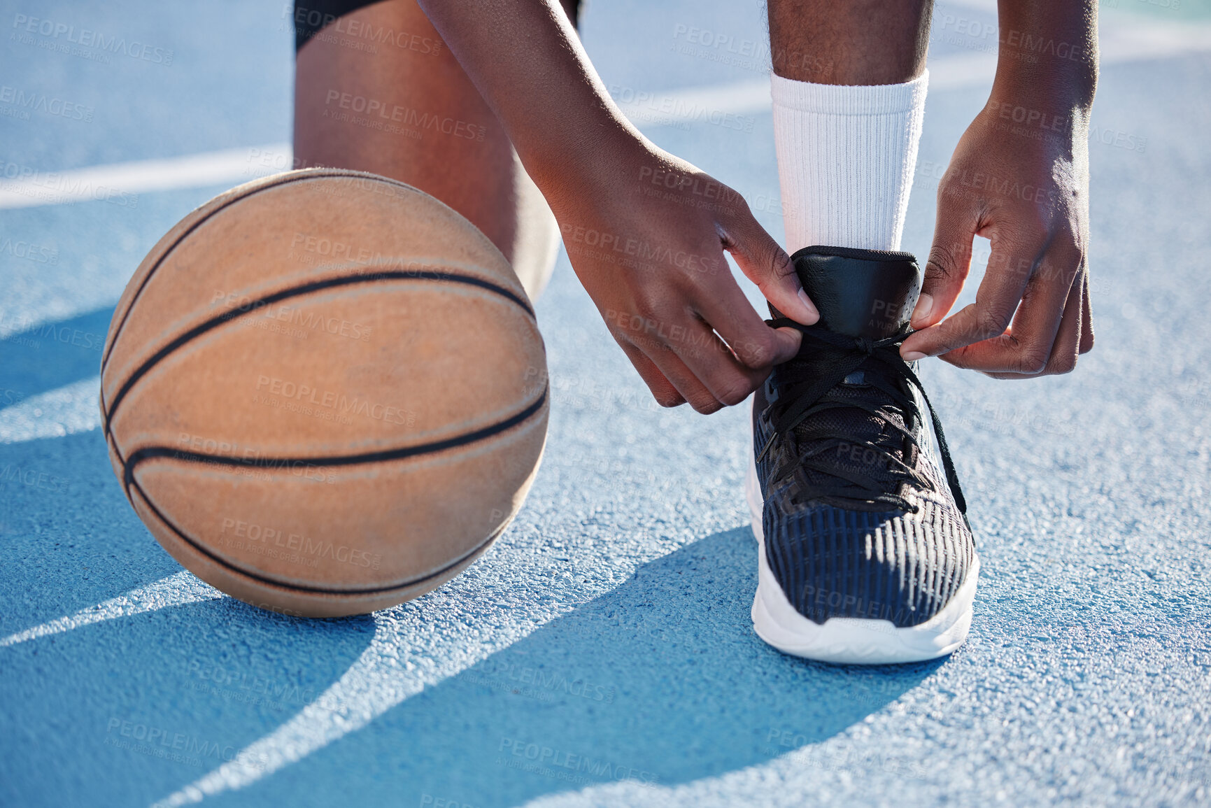 Buy stock photo Fitness man on a court with a basketball for training, exercise and a workout by playing sports in athletic shoes. African athlete living a healthy, wellness and motivational lifestyle in summer