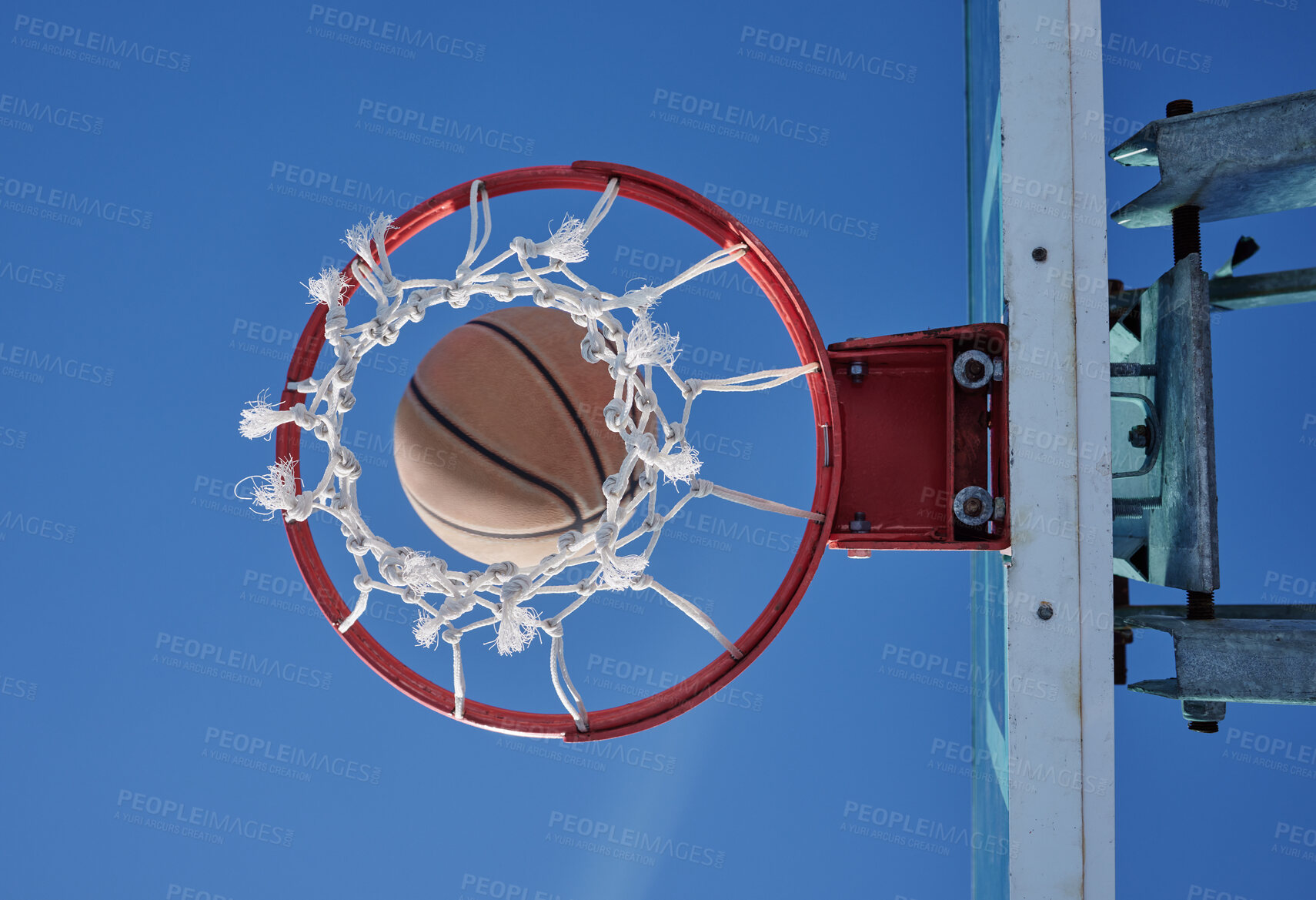 Buy stock photo Basketball sports winner throwing, shooting hoops and slam dunk for points, score and performance during sports, competition and game match from below outdoor. Background of net, hoop and goal target
