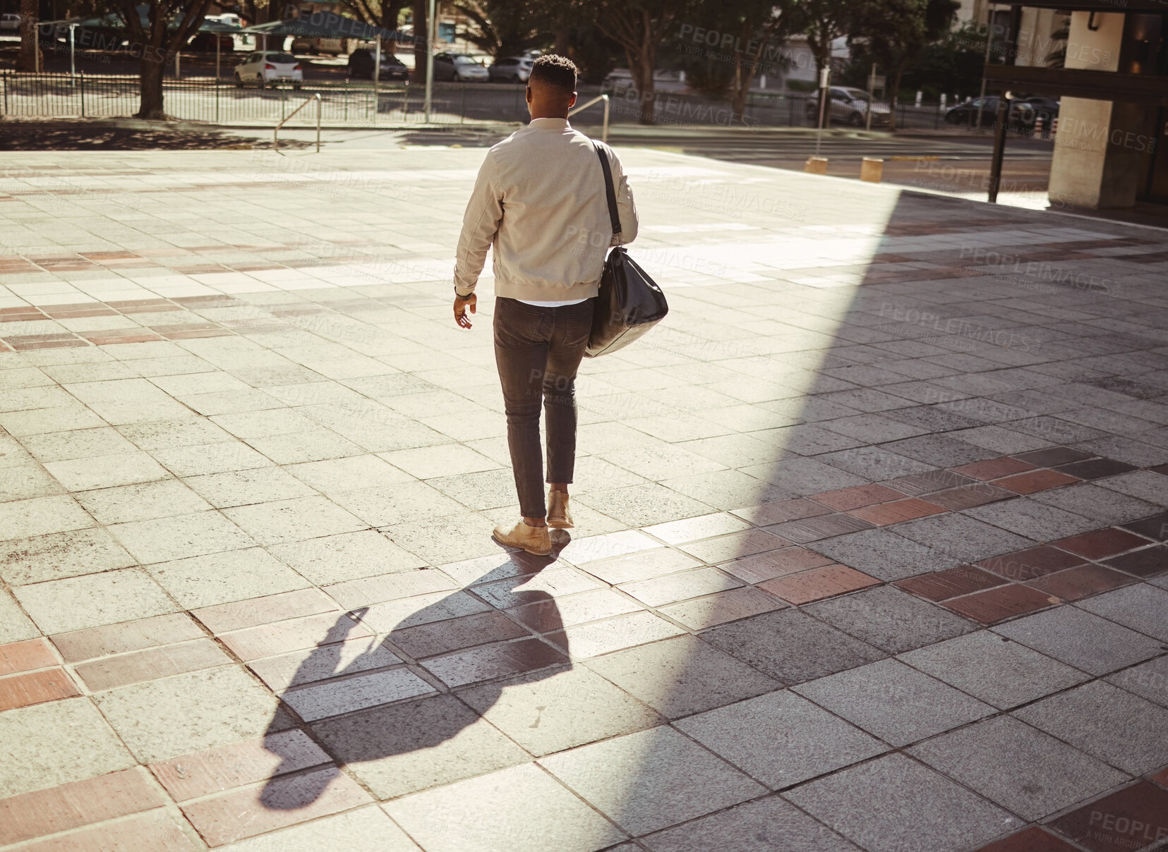 Buy stock photo Business, travel and city with a young man walking outdoors against an urban background in the day. Entrepreneur or employee looking for work, a job or ready to start a career on a summer morning