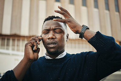 Buy stock photo Tired, angry and stress business man talking on an annoying phone call outdoors in a city. Frustrated, pain or sick black male entrepreneur with a headache or migraine outside a urban town