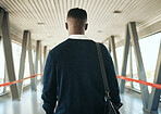 Travel, vision and black business man taking trip to meeting or global networking seminar, rear view of entrepreneur at the airport. Young professional on mission to upskill and achieve career goals