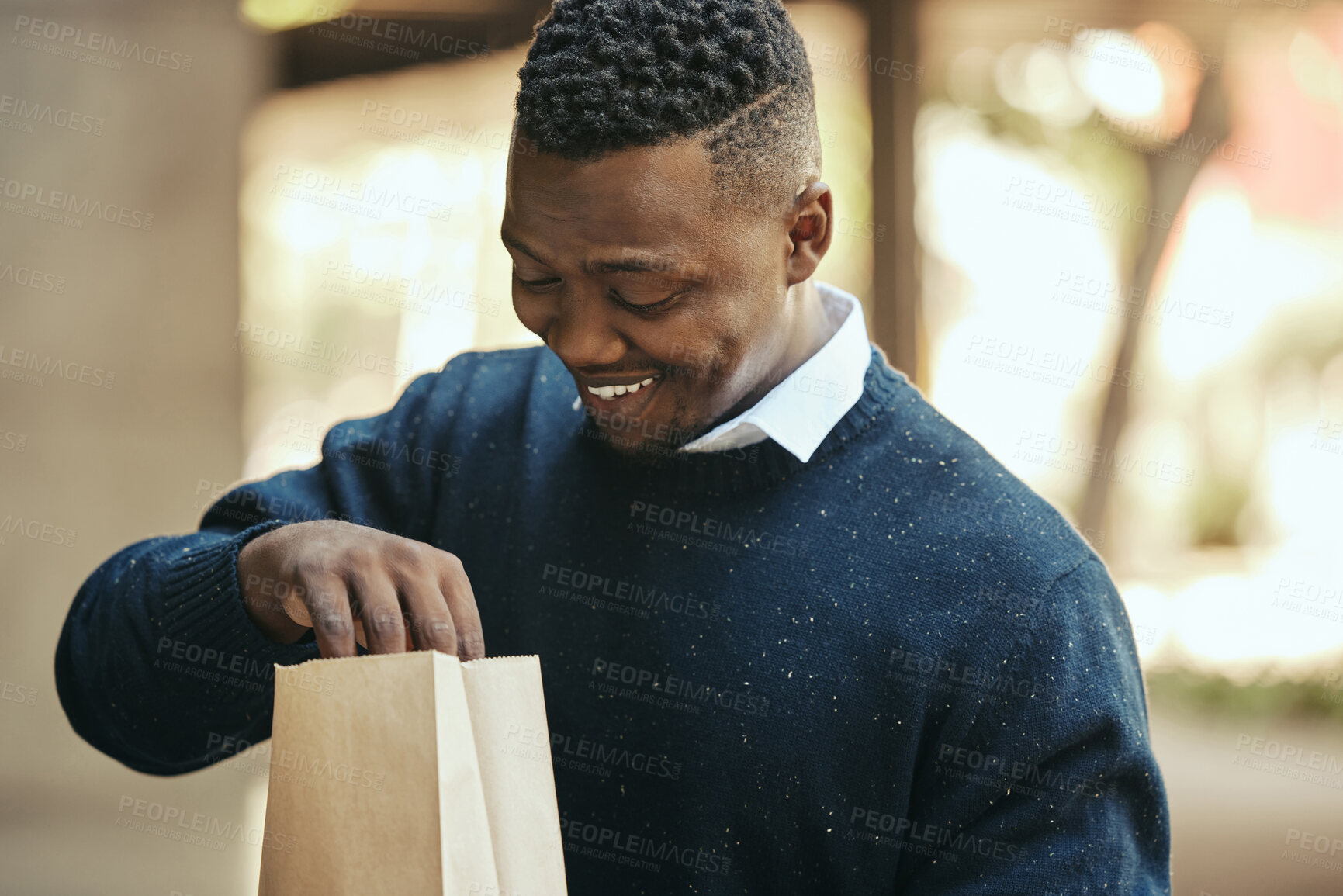 Buy stock photo Food, delivery and happy business man on a lunch break outside, smiling while opening a brown paper bag. Hungry worker satisfied with meal order, ready to enjoy a snack. Male impressed by deliver app