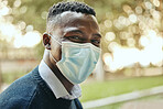 Face, mask and covid of a black businessman in the city for health and safety in the outdoors. Portrait of a happy man in a pandemic alone outside in nature with mockup background.