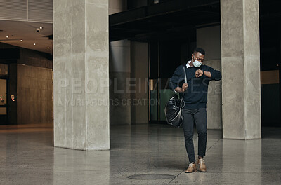 Buy stock photo Covid, travel restrictions and time with a business man looking at his watch and late in an airport. Leaving the office or a hotel in hurry or rushing after working overtime on a corporate deadline