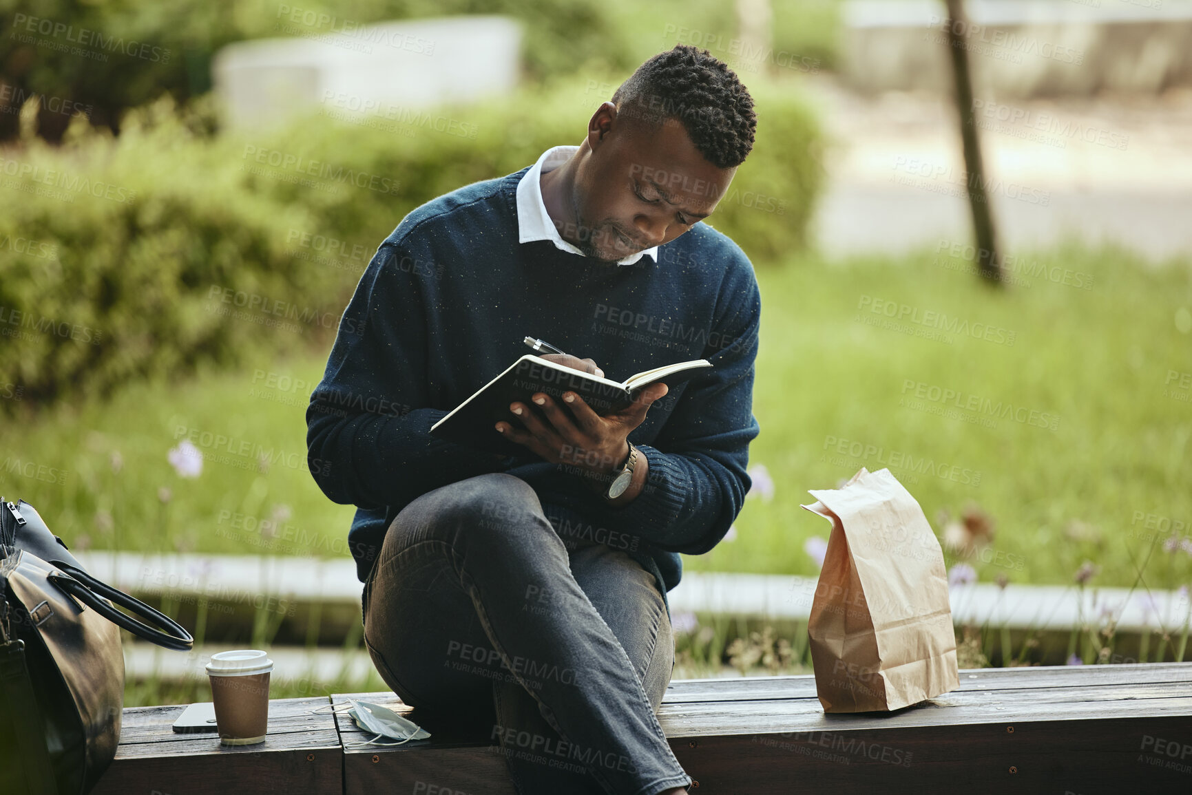 Buy stock photo Writing, creative thinking and planning businessman sitting on park bench working on corporate strategy. Employee man taking lunch break from office to work on schedule and write in a notebook.